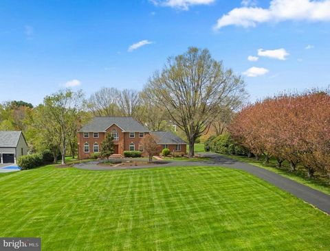 *** Open House Sunday April 14th 1-3 pm *** Discover refined living in this well crafted all brick 6-bedroom, 4.5-bath estate home nestled on 2.4 acres in Great Falls. Tucked back from the road, a charming tree-lined driveway leads to the inviting do...