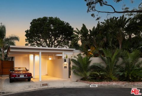 Introducing 2102 Ridgemont, a rare Mid-Century gem in the West Hollywood Hills. This one-of-a-kind, magical, single-story retreat sits at the end of a cul-de-sac, offering a stunning and creatively remodeled living space. Bathed in natural light, it ...