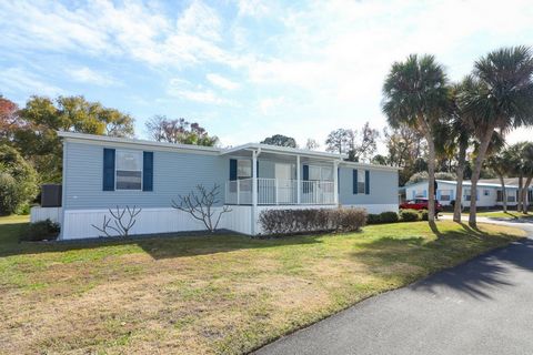 Hacienda Village 55+-2016 custom Palm Harbor Home w/garage and carport. Total parking spaces 3 in carport, 1 in garage. Family Room 18X14 plus 3 bedrooms 2 baths-Designed for owners-located on a corner lot-Lots of Details, all three bedrooms have wal...