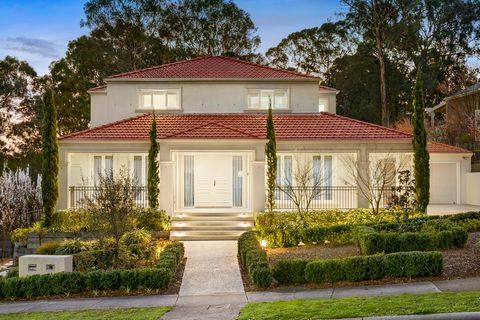 Framed by the tranquil treetops of native parklands and immersed in the sweet song of local birdlife, this serene sanctuary on 1700sqm is a sublime setting for family living. Built with uncompromising expense, the home showcases an elegant ensemble o...