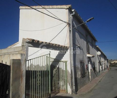 A spacious two Storey house for sale in the village of Llano de Los Olleres here in sunny Almeria Province.The house on the left hand side has double gates with a driveway leading to a garage.The house upon entry has a reception area with double bedr...