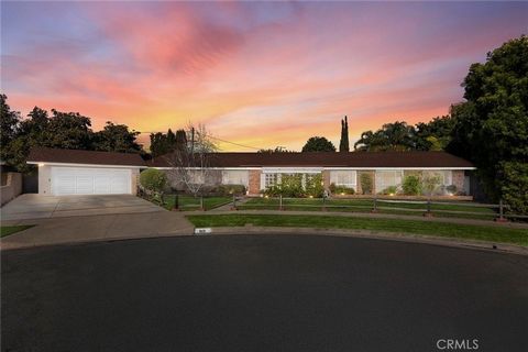 Nestled deep within a tranquil cul-de-sac, this impeccable single-story home welcomes you with an intimate gated covered courtyard, where a soothing fountain sets the tone for your grand entry. Step inside to discover an expansive open floor plan des...