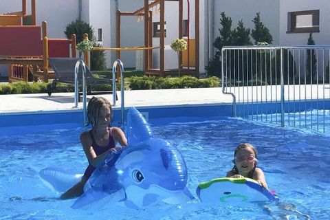 The family-friendly holiday complex was built in 2017 and has 15 modern holiday apartments. The complex offers you a communal outdoor pool and a children's pool, as well as many fun games and sports facilities. On the large grounds of 5000 square met...