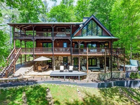 Look no further, you’ve found it! This beautifully landscaped mountain compound sits on over 7 acres of private land with stunning views throughout the year! A private paved road guides you to this spacious log cabin that has been beautifully and tho...
