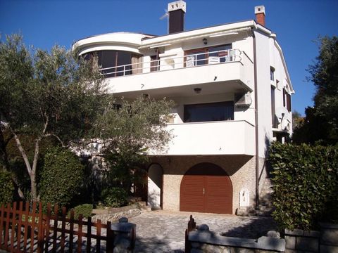 Super-attractive detached real estate with three apartments just 100 meters from the sea in the town of Krk! House has total area of 346m2 and a land plot of 523m2. It consists of a three levels. Basement offers garage, storage and boiler room. Groun...