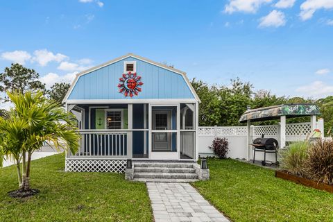 Welcome to your brand-new cottage in Cocoa, Florida! This charming tiny home offers one bedroom and one bathroom, a full-sized kitchen, and a spacious living area. You'll love the oversized loft that can easily fit a king-sized mattress, which is abo...