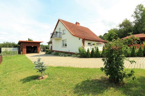 • 1700 m2 of developed plot area • detached house with a built-up area of 97 m2 • 4 rooms, 2 bathrooms • tin garage • 38 m2 of the outbuilding area with a garage • stocked pond • well-kept garden with many plantings and a driveway • a large shelter w...