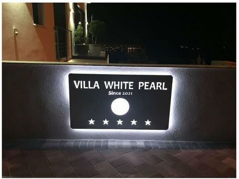 Villa White Pearl Diamond with sea view and shared pool above the roofs of Opatija