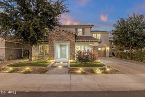 LIVE DESERT LUXURY IN GILBERT'S WATER TREE LINED DESTINATION MASTER PLAN...THE BRIDGES. THIS DISTINCTIVELY CRAFTED WOODSIDE HOME portrays EVERYDAY FUNCTIONALITY & DESIGNER LIVING in all ways. BUILDER'S FORMER ''Legacy Primo'' LUXURY RESIDENCE showcas...