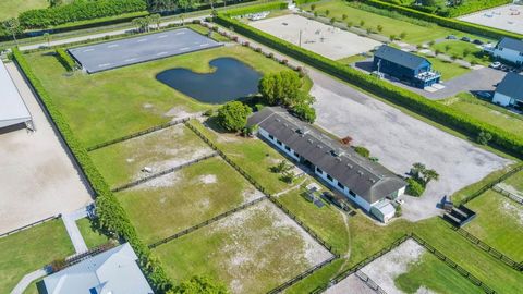 BEST LOCATION to build your equestrian dream home on 5.37 acres next to existing 16 stall barn, paddocks and riding arena on a private road off Pierson and South Shore Blvd. This property is in a coveted neighborhood of professional horse farms and l...