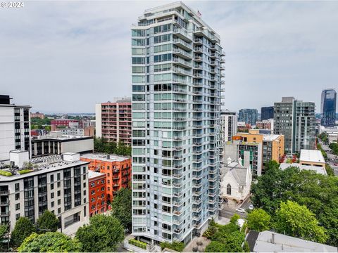 Nestled in the heart of the Cultural District, this fabulous corner unit features two walls of windows with lovely southeast-facing views. The covered private balcony overlooks the tree line of nearby parks offering the perfect all-season outdoor ent...