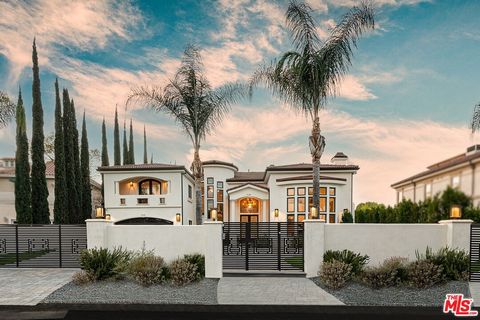 Located on a serene cul-de-sac in the highly sought-after flats of Tarzana, south of the Boulevard behind gates, this is truly a master-planned estate. Surrounded by other distinguished estate homes, the property welcomes you with a circular driveway...