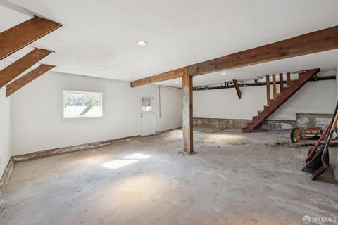 Charming mid-century home with a front living room bathed in natural light from a picture window featuring a wood-burning fireplace and beautiful hardwood floors. The dining and kitchen area is highlighted with a skylight, multiple windows, refrigera...