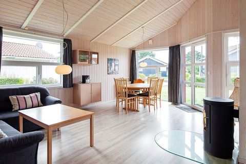 Comfortable quality wooden house in Danish building style from 2008 located in OstseeStrandpark in Grömitz. The house has panoramic windows, furniture in a modern, Scandinavian design and wood-paneled walls and sloping walls that make the house appea...