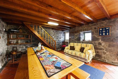 Stone house typical of the region with a feel-good character! The two-storey house is located in a rural area on the north coast of Pico, just 300 meters from the Atlantic Ocean. The characteristic stone walls, the wooden ceilings and floors ensure f...