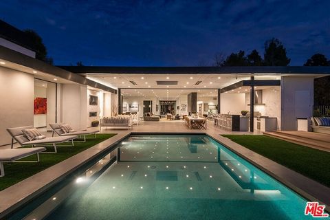 Located in Beverly Hills proper & serviced by the Beverly Hills Fire & Police Departments, this remarkable museum Modern estate is set up an apx 200 ft long gated driveway on an almost 1 acre lot in prime Trousdale Estates. Perched on a knoll far abo...