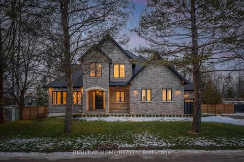 This impeccable custom 5-Bedroom home is a true masterpiece, seamlessly blending luxury and nature. Nestled only one street off Lake Simcoe on an oversized 100ft wide lot, this residence boasts just under 4000 sqft above ground with a full sized base...