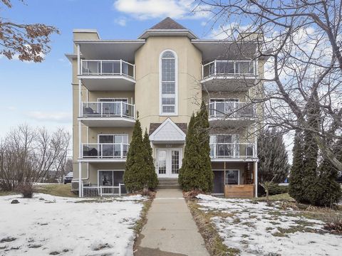 This great condo located on quieT crescent has 2 bedrooms plus (office/laudry room) on first level. This amazing property has a bright open concept large spaces, 2 outdoor parking with shed and private storage on front balcony. Near all amenities , h...