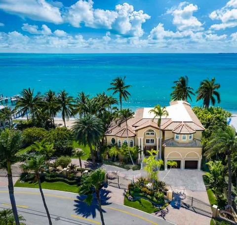 Welcome to The Sandcastle, nestled within exclusive Key Colony Beach, this custom D'Asign Source home epitomizes luxury and boasts open water views! Situated on an immaculate, gated double lot, with a private sandy beach and lush tropical landscaping...