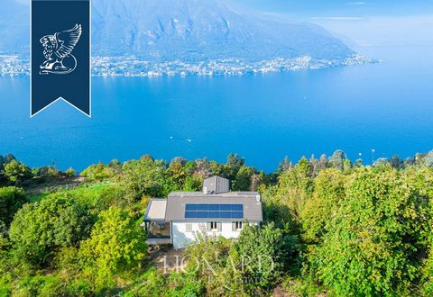 Immersed in the greenery on the hills surrounding Lake Como, this modern luxury villa develops on 3 levels designed according to a minimalist and elegant design, with terraces and panoramic views. The property has a total of 240 square meters of inte...
