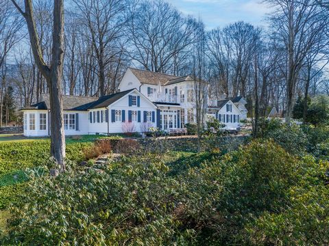 This impressive colonial, renovated by Form Ltd. in 2017, is perched on 1 acre above a private lane just minutes from downtown New Canaan. With 4,256 sq ft of living space on 2 floors and a carriage house studio, this 3 bedroom home is beautifully ap...