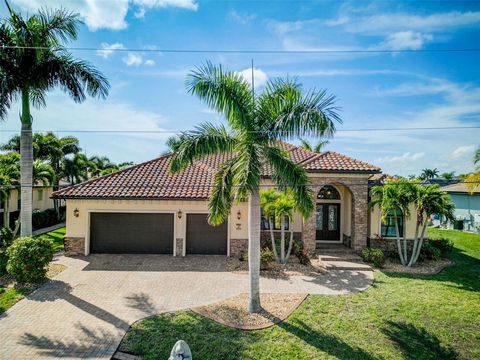 One or more photo(s) has been virtually staged. Welcome to your waterfront oasis in beautiful Punta Gorda Isles, where luxury living meets unparalleled waterfront access. Nestled along the serene saltwater canals, this sprawling residence offers a ra...