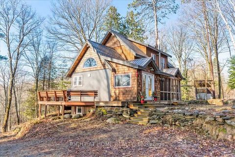 The epitome of luxury living crafted Haliburton haven. Positioned in a tranquil oasis, just a leisurely 3-min drive from lake access, this professionally designed residence boasts 3 bedrooms plus a sophisticated office space. Exquisite maple hardwood...