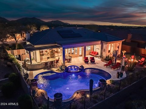 This exquisite home in prestigious Anthem Country Club offers a luxurious living experience. The stunning mountain and golf course VIEW can be enjoyed from the comfort of your own Home. The outdoor entertainment space is equally impressive, with a po...
