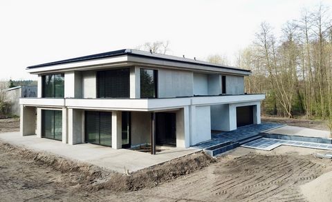 A quiet residence on the edge of the forest - a dream come true of living in harmony with nature! The most beautiful house in Borówiec - modern, energy-saving and richly equipped. Ready for finishing touches and moving in! This unique house with an a...