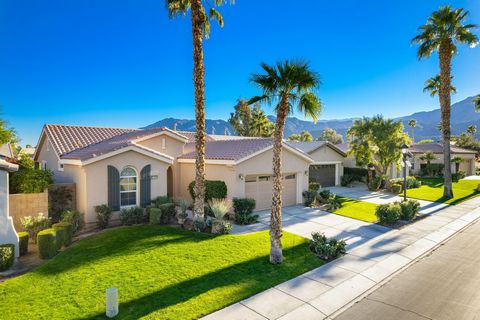 Simply Enchanting, this lightly lived-in, 2 bedroom, 2 bath, 1,386 square foot Maurea Model home features a large sunny backyard with stunning southwest mountain views, a large covered patio and mature landscaping of mini-palms, bright red bougainvil...