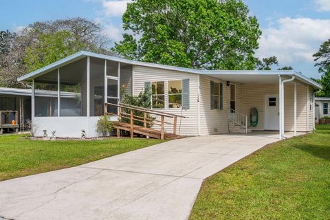 Double Wide 2000 year open Plan-Smaller, but very modern, 2-bedroom I bath- All Neutral-Great Location-Beautiful front-Home sits on a hill- Home sits on a hill, Maytag refrigerator and range, Shingle Roof! Screened Porch. Hacienda Village a legacy Co...