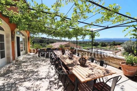 Situated in one of the most beautiful villages in the South of France, this property boasts panoramic views over the Luberon and the surrounding area. With almost 500m2 of living space, its interior volumes are generous, offering a beautiful 72m2 liv...