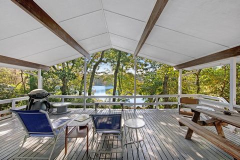 Imagine enjoying your morning routine on the oversized porch, overlooking Seth's Pond. The layout is designed for both privacy and togetherness, with a welcoming living room and dining area. Immerse yourself in the beauty of the outdoors. The spaciou...
