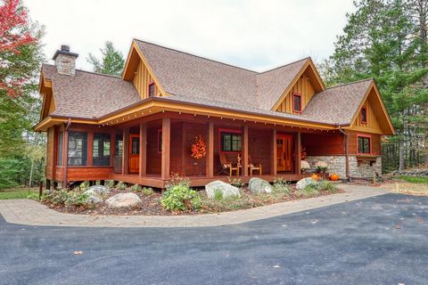 Nestled within the Chequamegon National Forest, this stunning waterfront retreat offers a perfect blend of rustic charm & modern luxury - making it ideal for both vacation getaways & year-around living. Ole Lake (90 acres) provides a tranquil backdro...