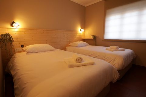 Double room with private bathroom at Santa Sea & Sun hostel located on the beautiful Santa Cruz Beach, Torres Vedras council. The room has air conditioning, television, USB sockets and Wi-Fi. A few minutes walk from the beautiful West coast where sur...