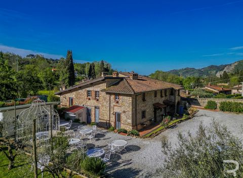 The pleasure of living in harmony with the surrounding nature in a perfectly restored stone farmhouse in Tuscany. The farmhouse for sale in Camaiore dates back to an old mill dating back to 1500 and is surrounded by a beautiful two-hectare olive grov...