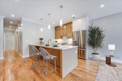 Nestled on a tree-lined street in The Heights, this brand new construction home brings the very best of modern luxury and ultimate lifestyle. The beautiful red brick building boasts a three bedroom home with must-have private backyard and coveted gar...