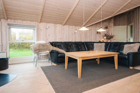 Bright and functional holiday cottage located on a 1200 m² large enclosed plot with lawn, small fire place, football goal, swing and sandpit. Short distance to the North Sea and the large sandy beach where you can still find amber on the beach. The h...