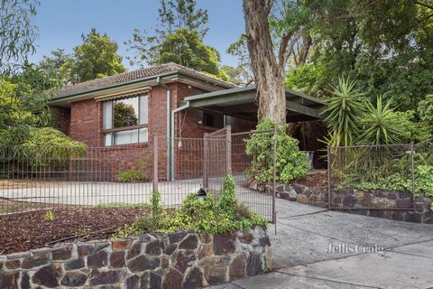 Poised on an expansive 970sqm block with a wide 20m street frontage, elevated on the high side of the street to boast magnificent panoramic treetop views towards the Dandenongs, this generous brick home offers an exciting array of future possibilitie...