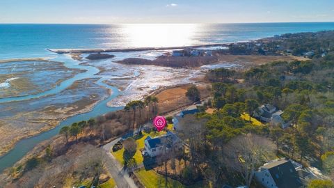 Charming Coastal Retreat Sings with Marsh and Ocean Views! Discover the perfect blend of serenity and seaside living at Wind Song, a stunning four-bedroom home overlooking the picturesque marshes of Nantucket Sound and Red River. Located just a stone...