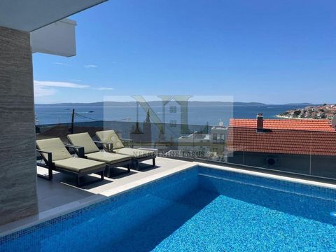 We are selling a new luxury villa with a swimming pool in Okrug Gornji, Ciovo island, south side. It is fully furnished and has a rich additional content and top-quality equipment. The villa area is 300 m2, the pool area is 19 m2, and the plot area i...