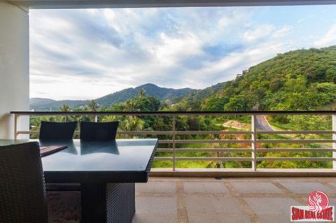 Large 102 sqm (128 sqm including balconies) two bedroom condo for sale in Karon Beach. This unit has a spacious balcony terrace with a outdoor dining table and lounge chairs to enjoy the great mountain views. The living plan is open with a living are...