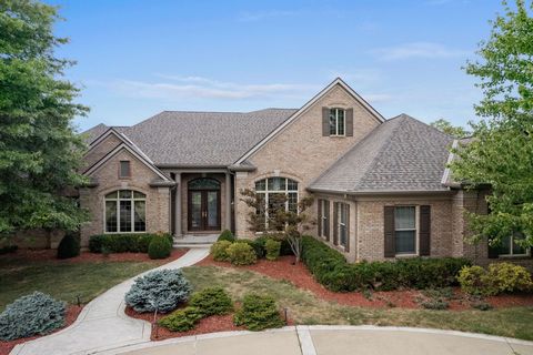 Stunning All Brick Ranch on Double Lot with Lake view In The Prestigious Triple Crown Community*Secluded Gated Street*New Beautiful Brazilian Hardwood Floors*Newer Travertine Floors in the Gourmet Kitchen with Built-ins, Breakfast Bar, Jenn-Air Appli...