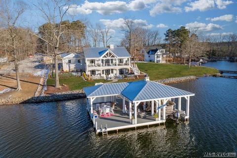 Experience luxury lakefront living in this stunning 2024-built home. Featuring 3 master suites, 3.5 bathrooms, & elegant engineered hardwood floors, this home is designed for comfort and style. The chef's kitchen boasts a Wolf range, Subzero fridge, ...